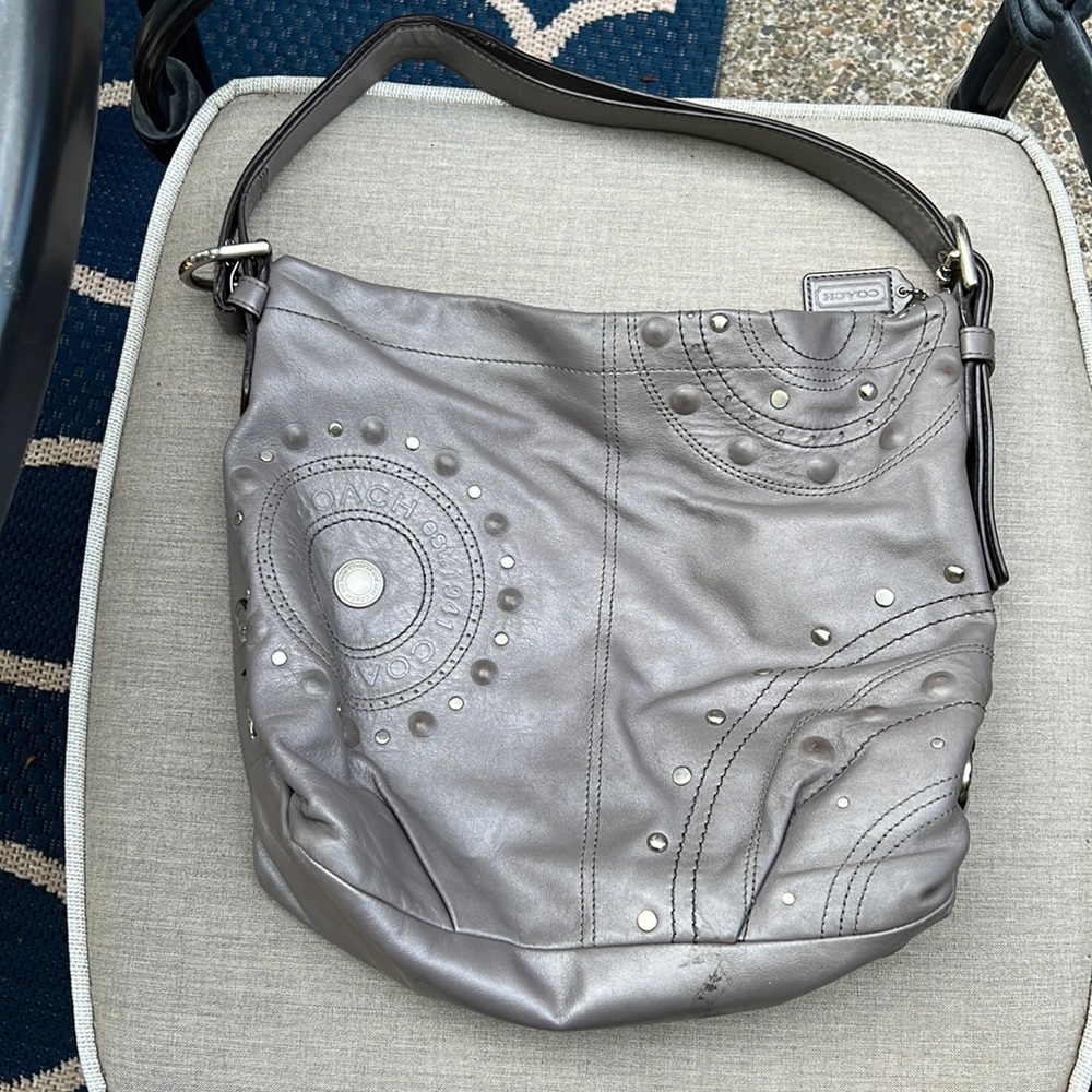 Soft leather Coach bag with black satin lining.